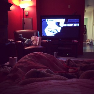 Here's me, snuggled up in my new bed watching Batman.